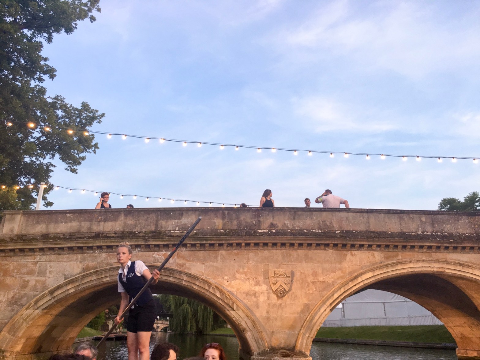 Punting and fairy lights over a beautiful bridge, Cambridge